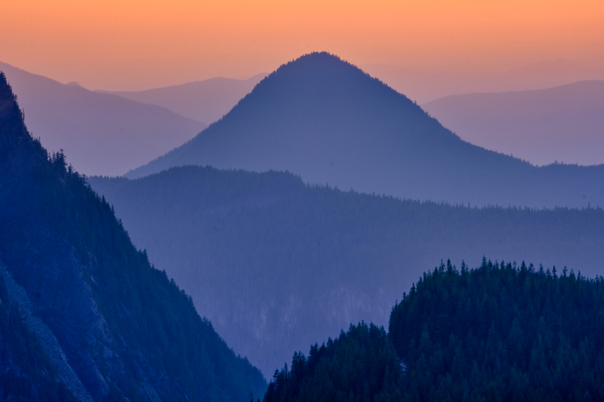 Washington mountains with orange sky at sunset