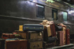 baggage next to old train car at train museum
